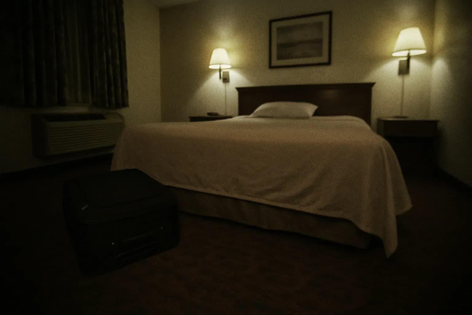 A motel room at the Rockford Inn, featuring a vacant bed with an untouched suitcase nearby, hinting at the tragic discovery of Amy Fry-Pitzen's suicide and the ongoing mystery of her missing son, Timmothy.